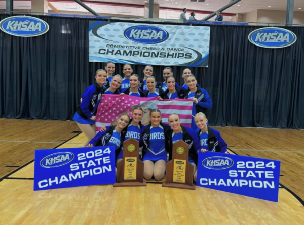 The Highlands Varsity Dance team with their trophies. (Photo from Highlands Dance Team)
